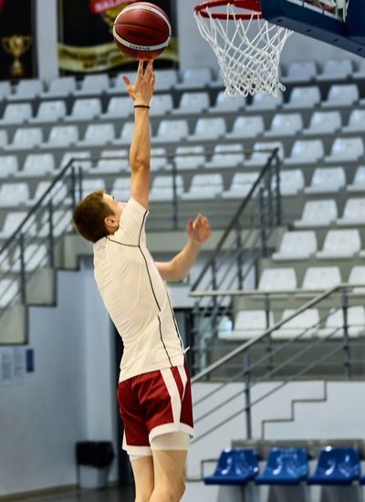 Teenager playing basketball