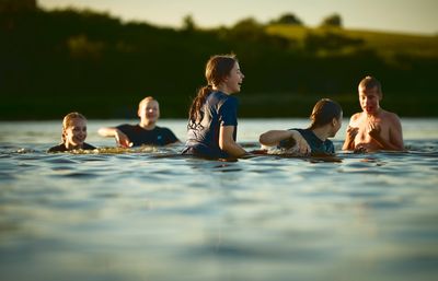 Girls swimming in a lake