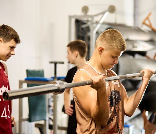 Kid lifting weights
